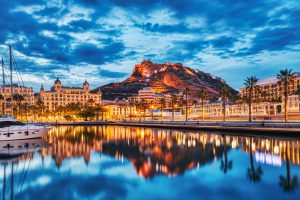 Illuminated,Alicante,Old,Town,Panorama,At,Dusk,With,Santa,Barbara